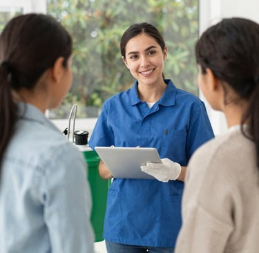 Technician treating perimeter of a home