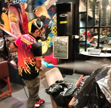 Dumaguete pest control technician performing ULV misting treatment, releasing fine disinfectant mist