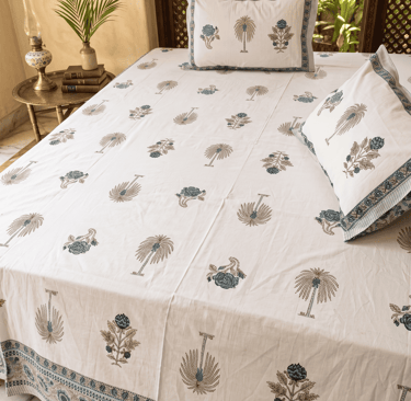 Authentic white cotton Jaipuri bedsheet featuring blue and gold palm tree block print motifs