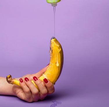 a banana peeler being held by a person's hand