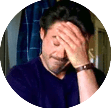 A man placing his hand to his head, displaying frustration.