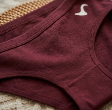 Close-up of sustainable bamboo fabric with soft luxury folds in a warm beige nude tone.
