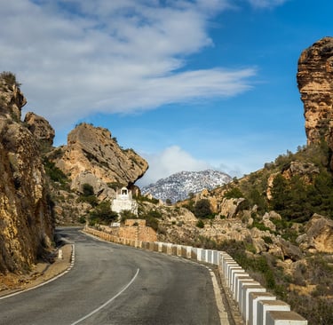 The gorge known as "Cortao de las Peñas" with the snow-capped Sierra de la Pila mountain range in th