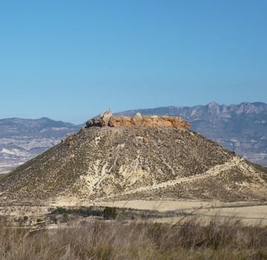 Hill on which stand the remains of the castle of Alcalá, also called the castle of Puebla de Mula, d