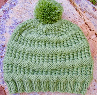 Handknit green textured beanie with pompom