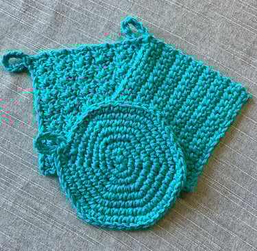 One round and two square aqua crocheted face scrubbies