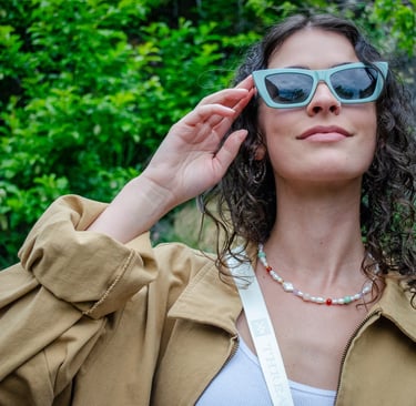 Woman smiling with eco-conscious eyewear outside