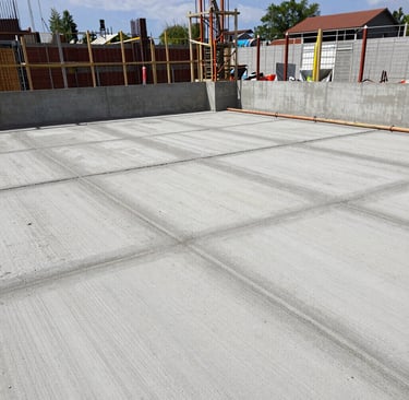 Sidewalk installation showcasing crisp, straight lines and a uniform finish in a sunny neighborhood.