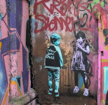 Street art at Rote Flora Hamburg with children stencil graffiti, urbane Kunst und Graffiti Szene in St. Pauli