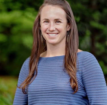 Image of Dr. Allie smiling against green outdoor background
