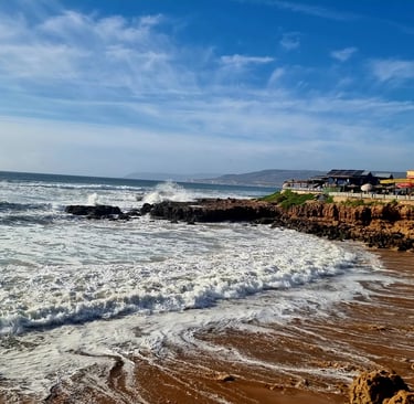 Group surf coaching session at Anchor Point, Morocco