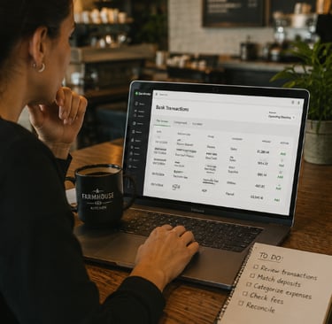 Bookkeeper reviewing imported QuickBooks transactions for accuracy