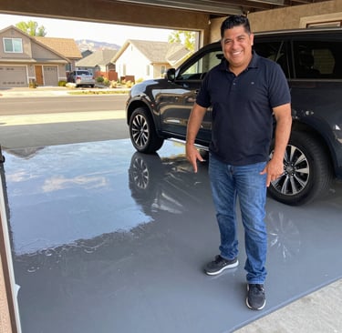 Benjamin and a satisfied client smiling together outside a freshly renovated home in Littleton, Colorado.