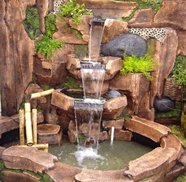 a waterfall fountain with a waterfall in the middle