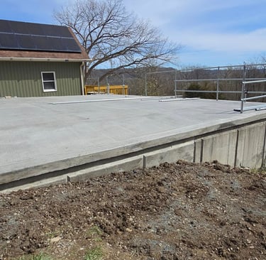 a concrete slab with a solar paneled roof