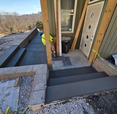 a house with a door and steps leading to a porch