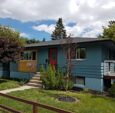 Exterior House Painting bungalow with two tone grey color with a accent red door