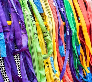 soft round slings lined up being inspected