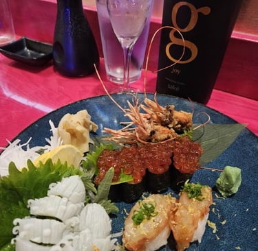 Ika with shiso sashimi, ikura nigiri, sweet shrimp nigiri and G Sake