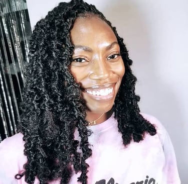 a woman with big black butterfly locs hairstyle