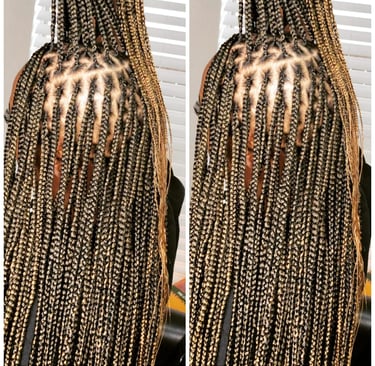 a woman with knotless braids hairstyle