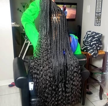 a woman with long small goddess braids