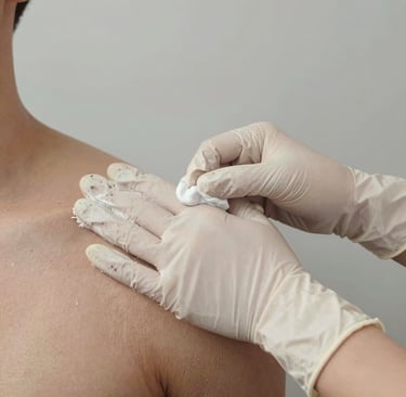 Close-up of nitrile gloves stacked neatly with a light blue background showing contrast and texture.