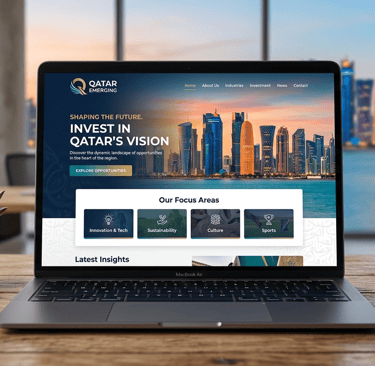 A MacBook Air displaying the Qatar Emerging investment website on a wooden desk with a Doha skyline view.