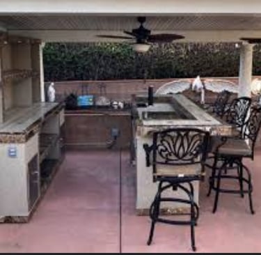 a kitchen with a bar stool and a bar stool
