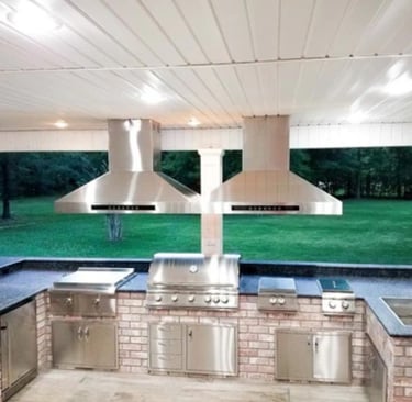 a kitchen with a grill and a grill