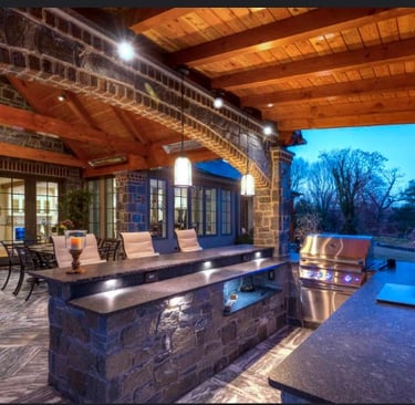 a kitchen with a bar stool and a bar stool