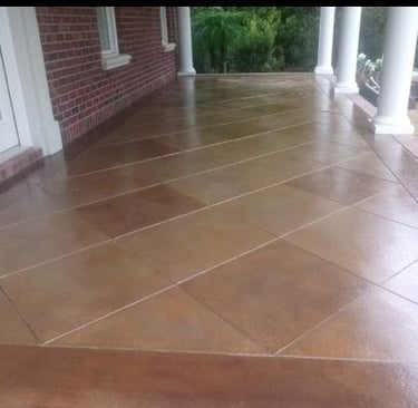 a porch with a brick wall and a brick wall