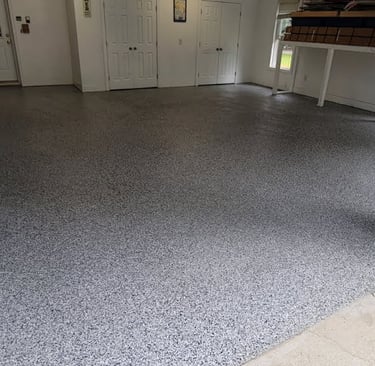 a garage flooring with a garage flooring and a garage door