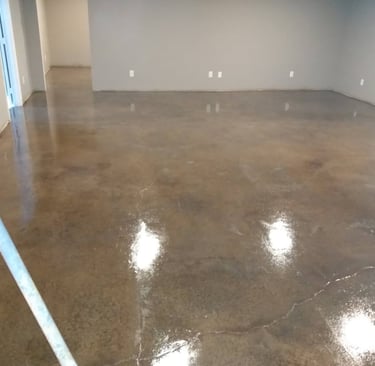 a room with a large floor plan and a white wall