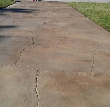 a skateboarder is riding his skateboard down a sidewalk