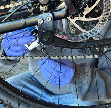 bike chain being lubricated