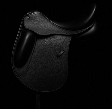 A black County Dressage Saddle, black background 