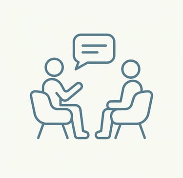 Line art icon of two people sitting in chairs having a conversation with a speech bubble.
