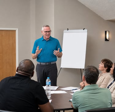 Doug presenting to a group of clients.