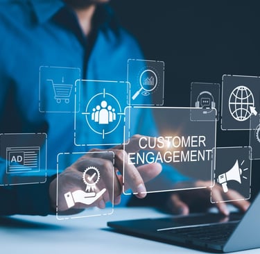 Professional person using a laptop with a digital customer engagement strategy interface and marketing icons.