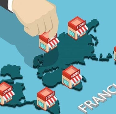 Isometric illustration of a hand placing franchise store buildings on a world map for global business expansion.