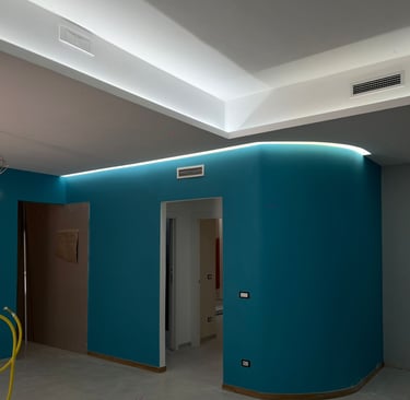 a room with a blue wall and a yellow chair