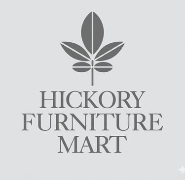 Hickory Furniture Mart logo featuring a gray leaf emblem above serif typography on a light background.