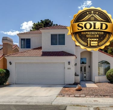 a sold sign that says sold in the foreground