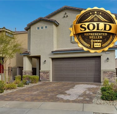 a home with a sold sign on the front of a house