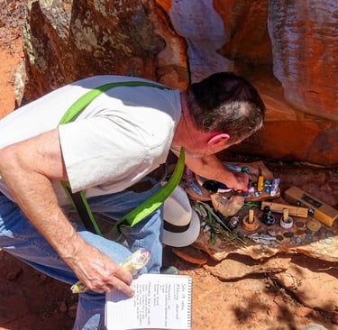 Jerry places our ceremony tools and offerings at the base of the medicine wheel's altar