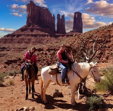 Riding horseback along the base of Stagecoach Butte in the heart of Diné Land (Monument Valley AZ)