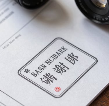Macro photograph of physical trade finance documents, official stamps, and high-quality textured paper under professional desk lighting.
