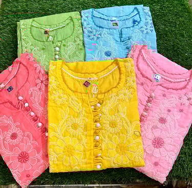 Handcrafted Chikankari cotton kurtis in vibrant summer colors with intricate white floral embroidery.