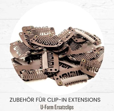 A pile of brown U-form replacement clips for clip-in hair extensions on a white background.